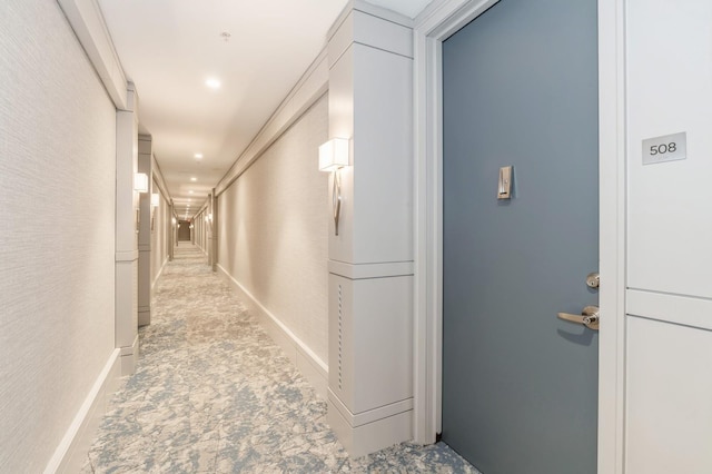 hallway featuring a textured wall