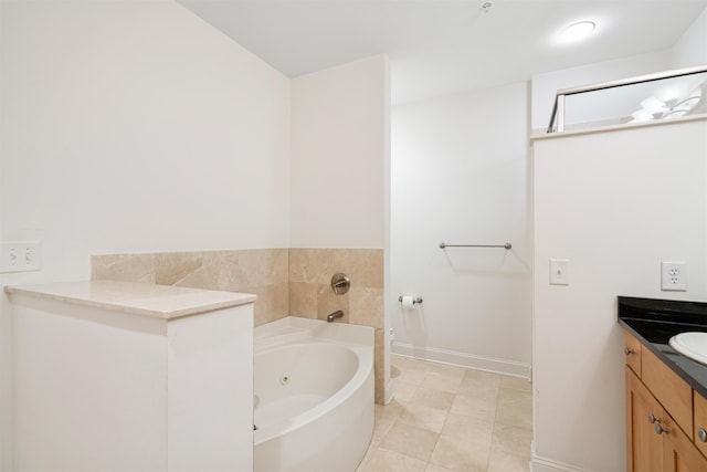 full bathroom with a whirlpool tub, tile patterned flooring, vanity, and baseboards