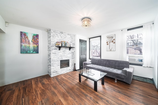 living area featuring a fireplace and wood finished floors