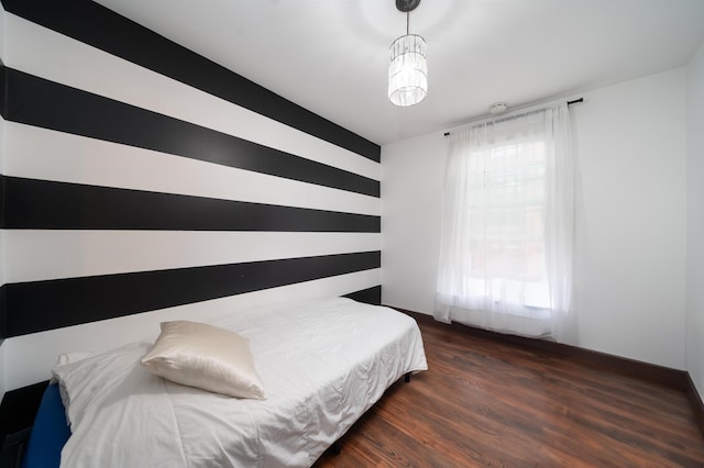 bedroom featuring wood finished floors