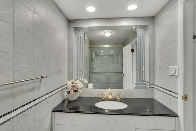 200 Winston Dr Unit 2502, Cliffside Park, NJ 07010 - bathroom featuring vanity, a stall shower, and tile walls