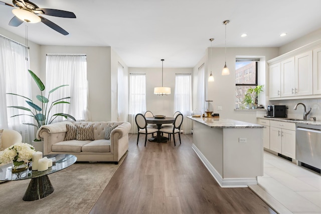 263 10th St Unit 2D, Jersey City, NJ 07302 - kitchen with dishwasher, a sink, plenty of natural light, and recessed lighting