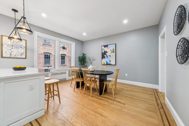 340 Fairmount Ave Apt 209, Jersey City, NJ 07306 - dining space with light wood-style flooring, recessed lighting, and radiator heating unit