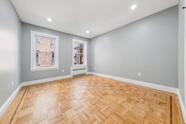340 Fairmount Ave Apt 209, Jersey City, NJ 07306 - spare room featuring radiator heating unit and recessed lighting