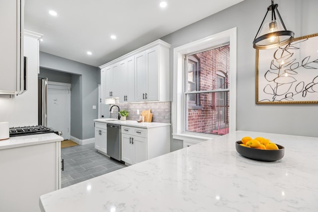 340 Fairmount Ave Apt 209, Jersey City, NJ 07306 - kitchen with stainless steel dishwasher, white cabinetry, decorative backsplash, light stone counters, and recessed lighting