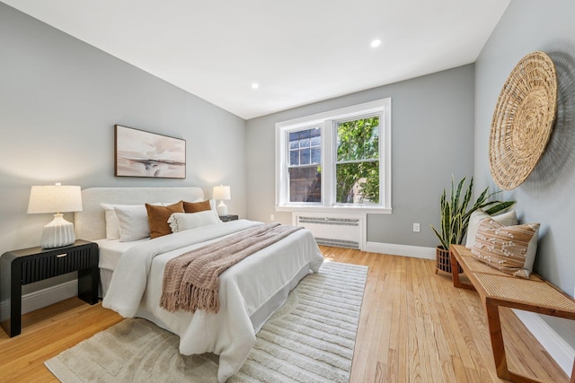 340 Fairmount Ave Apt 209, Jersey City, NJ 07306 - bedroom featuring radiator, light wood-style flooring, and recessed lighting