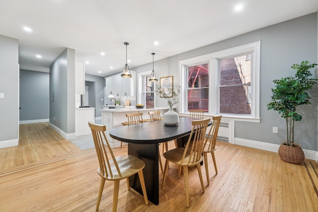 340 Fairmount Ave Apt 209, Jersey City, NJ 07306 - dining area with light wood finished floors, radiator, and recessed lighting
