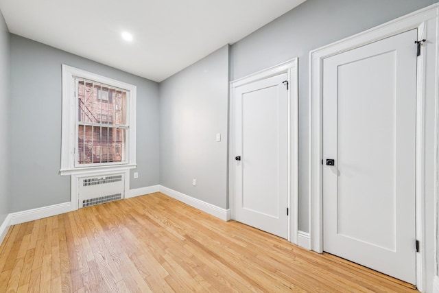 340 Fairmount Ave Apt 209, Jersey City, NJ 07306 - spare room featuring radiator, light wood finished floors, and recessed lighting