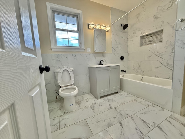 201 Livingston Ave, New Brunswick, NJ 08901 - bathroom with toilet,  shower combination, tile walls, vanity, and marble look tiles