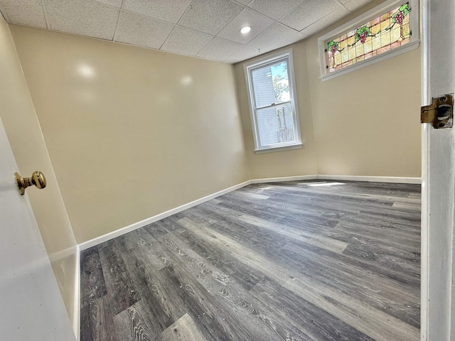 201 Livingston Ave, New Brunswick, NJ 08901 - empty room featuring a drop ceiling, baseboards, and wood finished floors