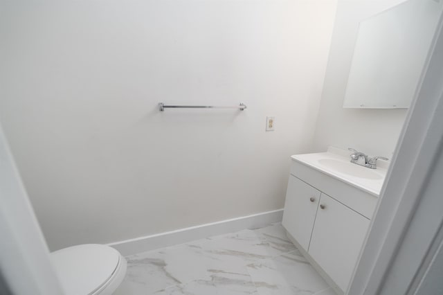 bathroom with toilet and vanity