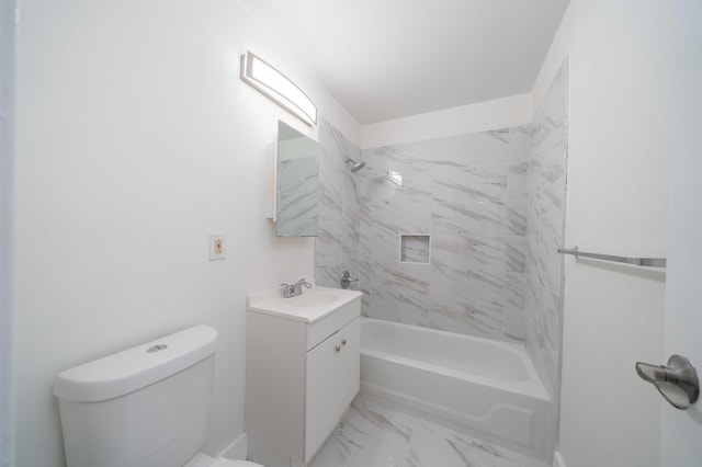 full bathroom featuring toilet, vanity, and tiled shower / bath