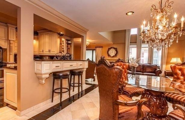 750 Mainsail Ln, Secaucus, NJ 07094 - dining space featuring an inviting chandelier, recessed lighting, light tile patterned floors, and crown molding