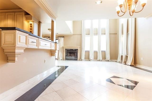 750 Mainsail Ln, Secaucus, NJ 07094 - unfurnished living room with a premium fireplace, baseboards, tile patterned flooring, and a chandelier