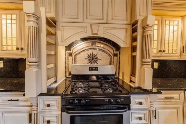 750 Mainsail Ln, Secaucus, NJ 07094 - kitchen featuring cream cabinets, gas stove, and glass insert cabinets