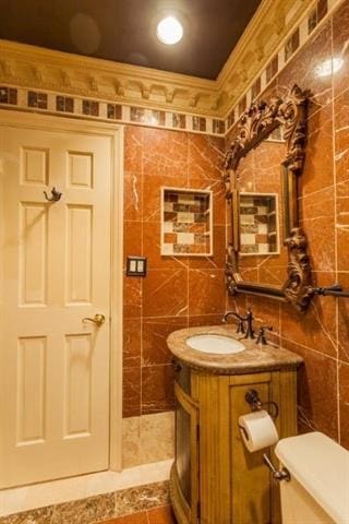 750 Mainsail Ln, Secaucus, NJ 07094 - bathroom featuring tile walls, vanity, ornamental molding, and toilet