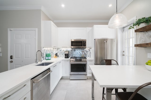 78 Madison St Unit 2, Hoboken, NJ 07030 - kitchen with stainless steel appliances, tasteful backsplash, white cabinetry, light countertops, and ornamental molding