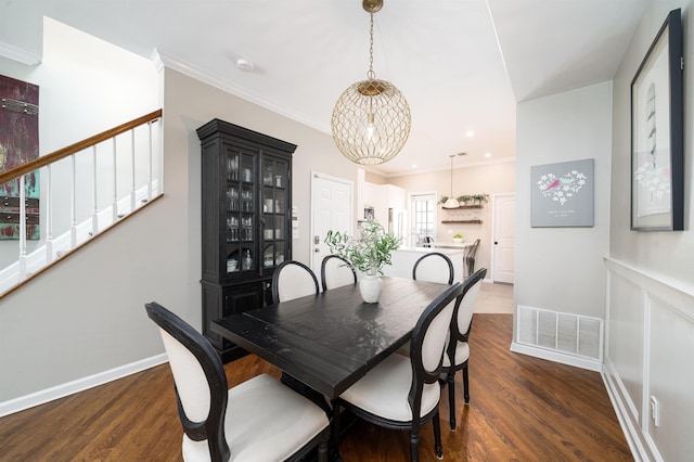 78 Madison St Unit 2, Hoboken, NJ 07030 - dining space with stairs, dark wood finished floors, crown molding, and a chandelier