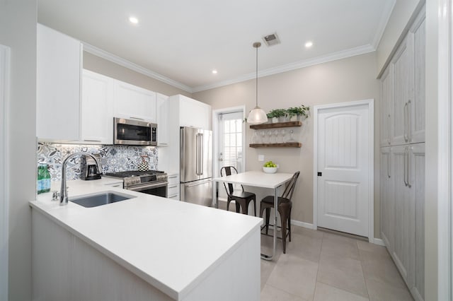 78 Madison St Unit 2, Hoboken, NJ 07030 - kitchen with appliances with stainless steel finishes, tasteful backsplash, open shelves, white cabinets, and hanging light fixtures