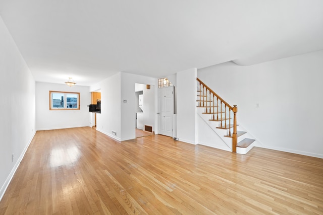 unfurnished living room featuring light hardwood / wood-style floors