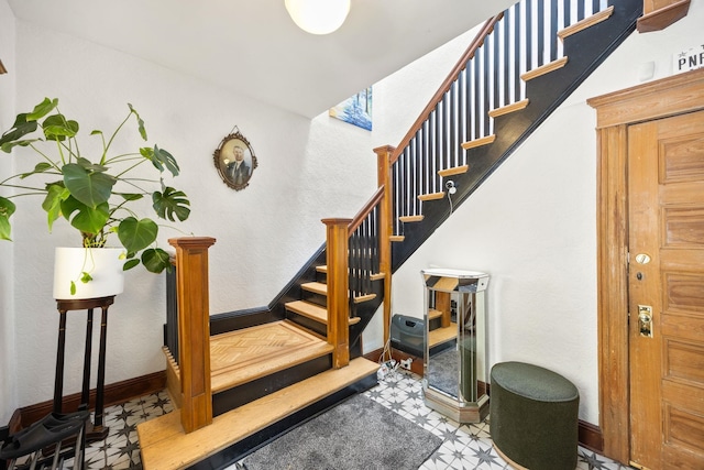 138 Kensington Ave Unit 3, Jersey City, NJ 07304 - stairway featuring tile patterned floors and baseboards