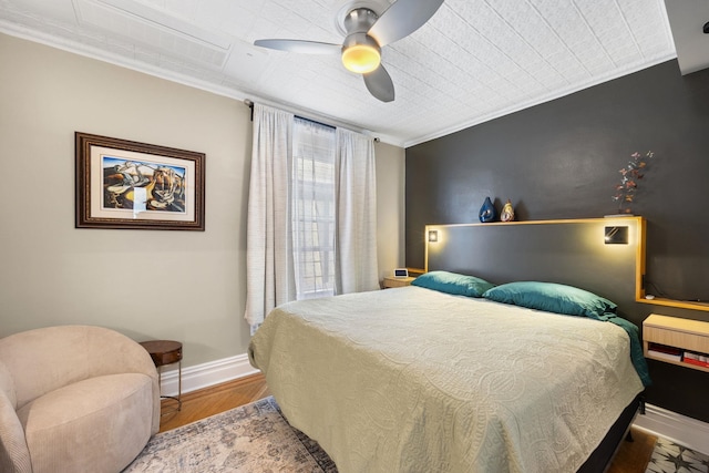138 Kensington Ave Unit 3, Jersey City, NJ 07304 - bedroom featuring a ceiling fan, baseboards, ornamental molding, and wood finished floors