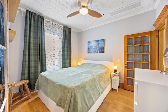 138 Kensington Ave Unit 3, Jersey City, NJ 07304 - bedroom featuring visible vents, ornamental molding, an ornate ceiling, light wood-style floors, and baseboards