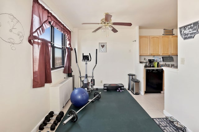 workout area featuring light tile patterned floors, radiator heating unit, and ceiling fan