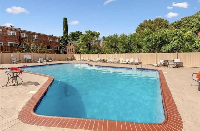 view of swimming pool featuring a patio area