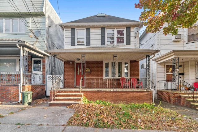 view of front of property featuring covered porch