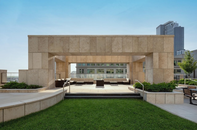 view of property's community featuring an outdoor living space, a patio, a pergola, and a lawn