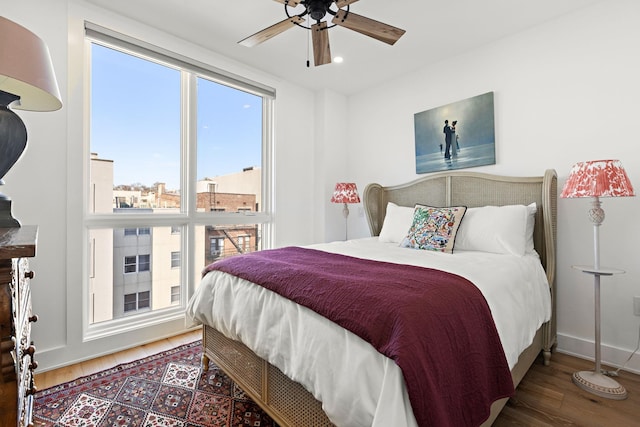 bedroom featuring recessed lighting, baseboards, a ceiling fan, and wood finished floors