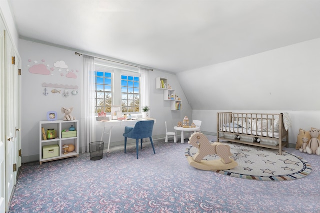 bedroom with a nursery area, vaulted ceiling, and carpet