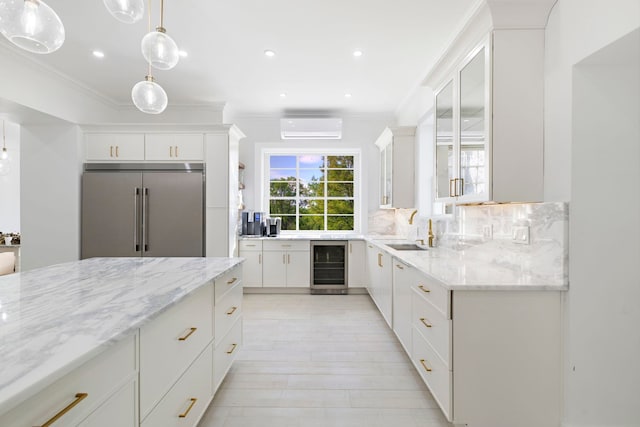 kitchen featuring white cabinetry, wine cooler, a wall unit AC, backsplash, and built in refrigerator