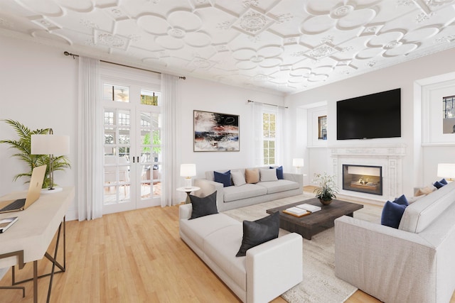 living room with french doors and hardwood / wood-style floors