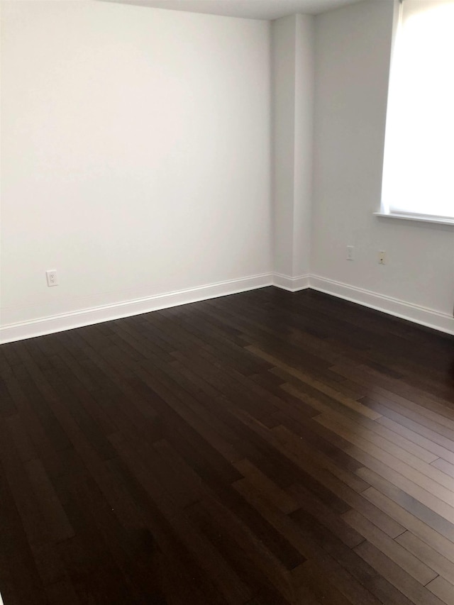 20 2nd St Unit 503, Jersey City, NJ 07302 - spare room with dark wood-style flooring and baseboards