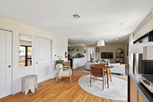dining room featuring light wood-type flooring