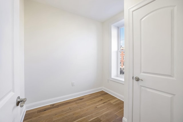 empty room featuring wood-type flooring