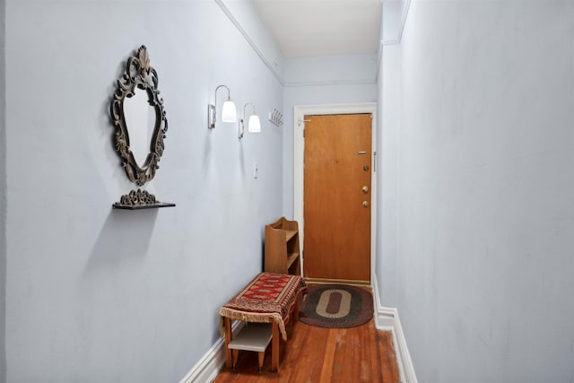 hall with wood-type flooring