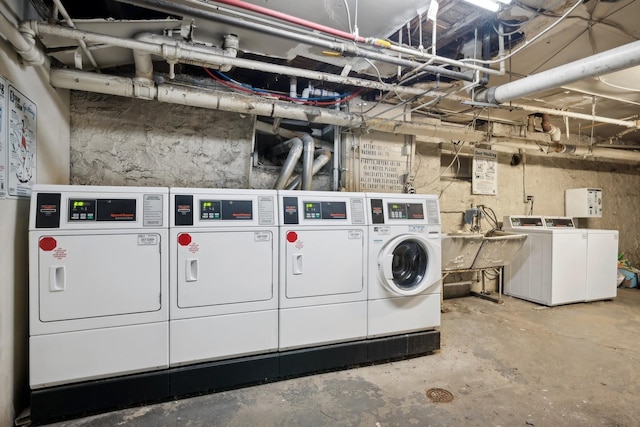 laundry room featuring separate washer and dryer and sink