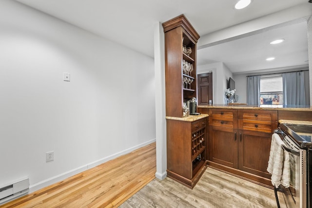 607 1st St Unit 1, Hoboken, NJ 07030 - indoor dry bar featuring stainless steel electric range, a baseboard heating unit, light wood-style floors, baseboards, and recessed lighting
