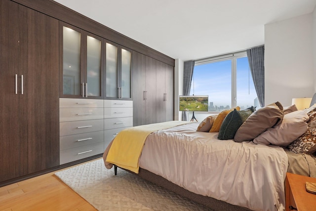 2 2nd St Unit 3103, Jersey City, NJ 07302 - bedroom featuring light wood-style floors