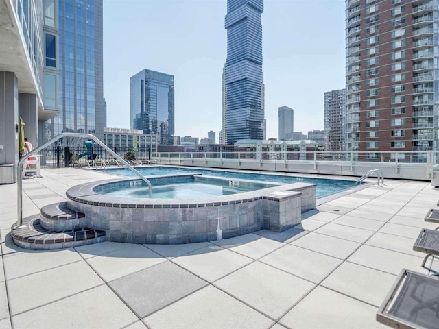 2 2nd St Unit 3103, Jersey City, NJ 07302 - view of pool featuring a view of skyline and a community hot tub