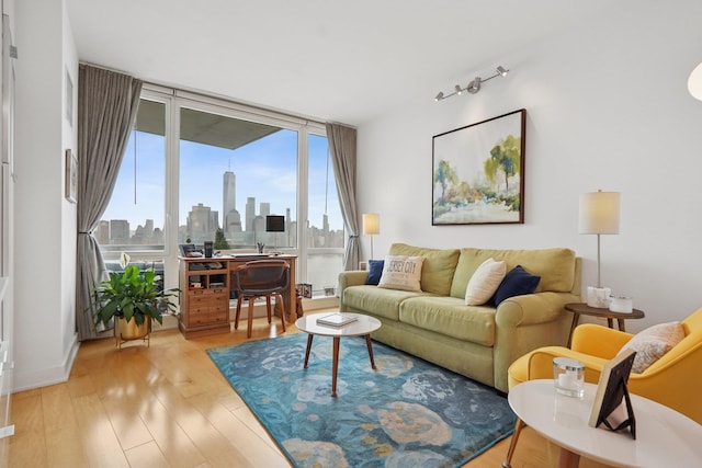 2 2nd St Unit 3103, Jersey City, NJ 07302 - living room with a skyline view and wood finished floors
