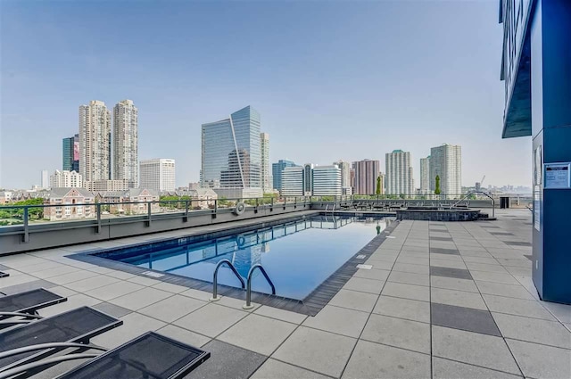 2 2nd St Unit 3103, Jersey City, NJ 07302 - community pool featuring a view of skyline and a patio area