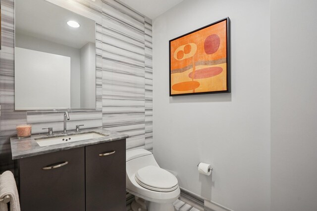 2 2nd St Unit 3103, Jersey City, NJ 07302 - bathroom featuring tile walls, vanity, toilet, recessed lighting, and baseboards