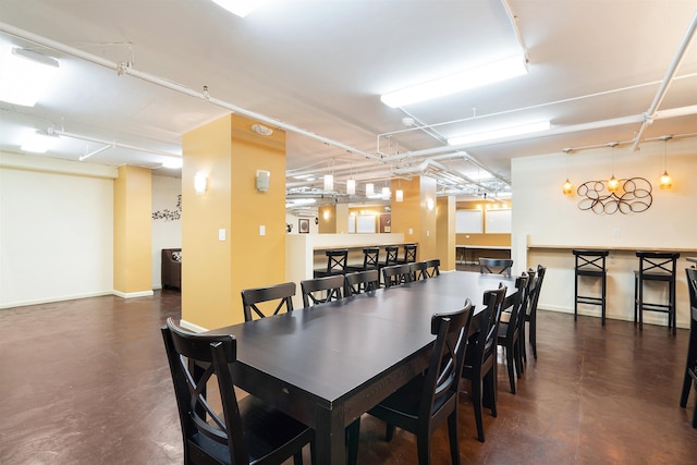10 Huron Ave Unit 17F, Jersey City, NJ 07306 - dining room with concrete flooring and baseboards