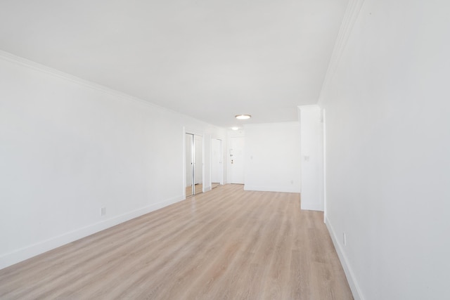 10 Huron Ave Unit 17F, Jersey City, NJ 07306 - spare room with light wood-style floors, ornamental molding, and baseboards
