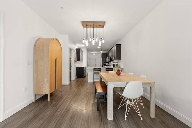 dining area with dark wood-type flooring