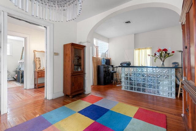1208 River Rd, Edgewater, NJ 07020 - interior space with wood finished floors, visible vents, and arched walkways